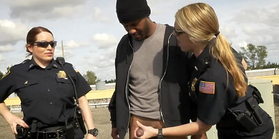 Two chubby female cops and black lad are fucking on the roof