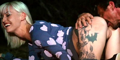 Inked blonde with big tits drilled by man outdoors near fire