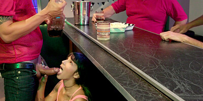 Kitty Carrera is sucking Alex Legend's cock under the bar stand
