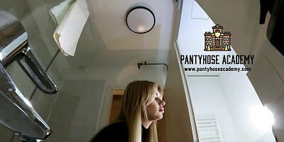 Big Tits Big Ass Hot Blonde Babe in Pantyhose and High Heels with a Miniskirt does a Striptease in the Bathroom