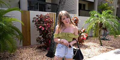 Alexa Kiss is getting picked up outdoors