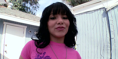 Rose Monroe in a tight jeans shorts posing in the backyard