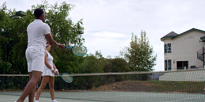 Busty August Ames flirting with her tennis couch
