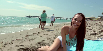 Redhead Aidra Fox has fun on the beach