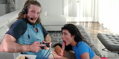 Adria Rae is sucking Brick Danger's cock as he playing video games