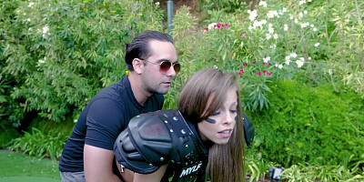 Britney Amber on her knees is sucking cock outdoors