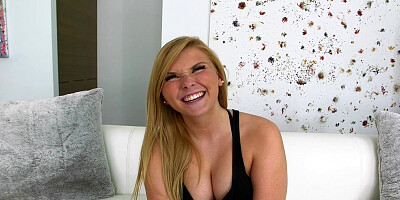 Melissa May in a black bodysuit showing off her curves