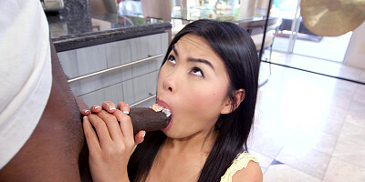 Cindy Starfall eats sushi and sucks black cock at the same time