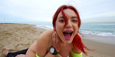 Redhead Paola Hard is riding Emilio Ardana on the beach