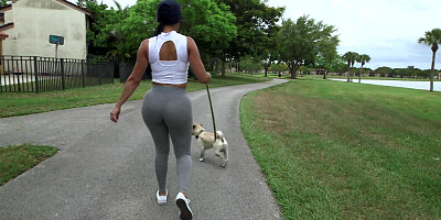 Diamond Kitty is walking with her dog and flashing her giant glutes