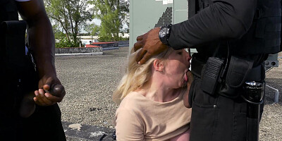 Kiki Parker deepthroats two black cops on the rooftop