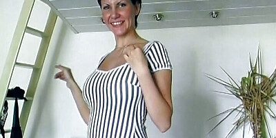 An attractive brunette German babe stuffs her cunt with kitchen tools