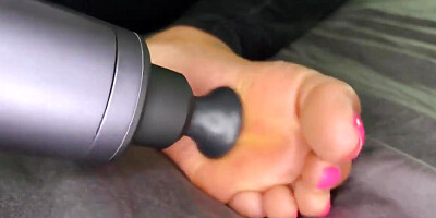 Ebony Girl Gives Her Feet a Massage with a Massage Gun