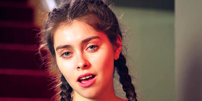 Brunette in a revealing outfit seeks pleasure on the steps