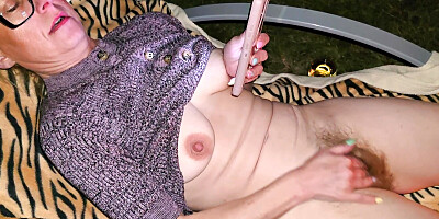 In the evening in the garden by the fire. She started undressing and masturbating. And I started recording it.
