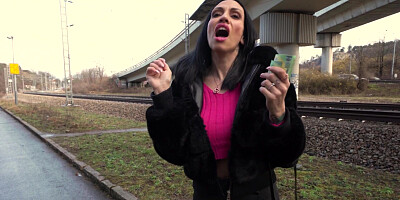 Giulia Diamond is playing with vibrator outdoors