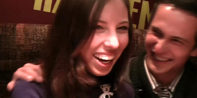 Two people are seen doing it in a restaurant together