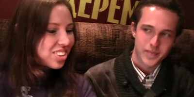 Two people are seen doing it in a restaurant together