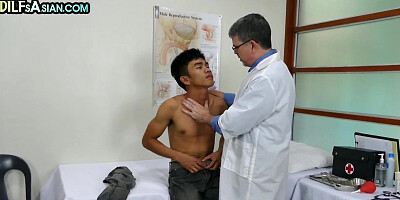 Mature doctor barebacks Asian twink on medical check