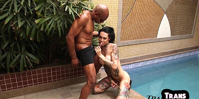 Tattooed TS deepthroating BBC by pool be4 getting assfucked