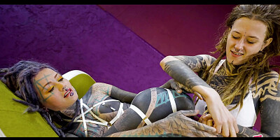 Tattooed hotties fuck each other with crazy toys