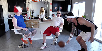 Katie Morgan is cleaning the kitchen while the guys are watching a game