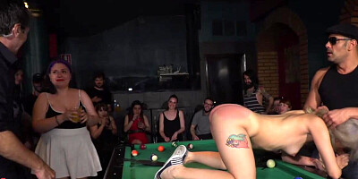 Blonde spanked and fucked in a bar