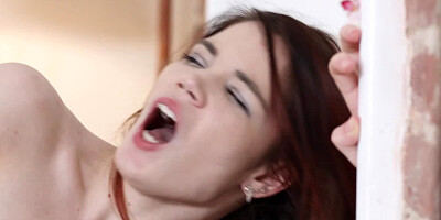 A small breasted brunette with a small pair of tits is riding a dick