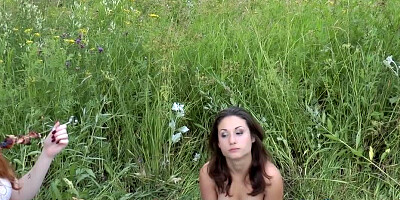 Two guys and girls are having sex outside with a smile