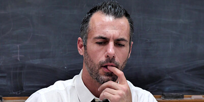 Gia Dibella is cleaning classroom in front of the teacher