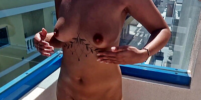 naked woman on the roof in the hotel pool