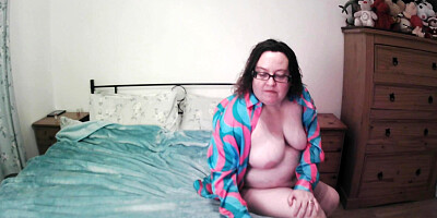 Wife on web cam playing with shaven pussy and showing off big tits