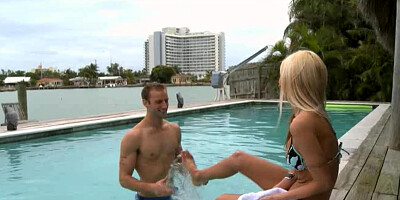 Blonde fools around in the pool with an athletic dude that she likes