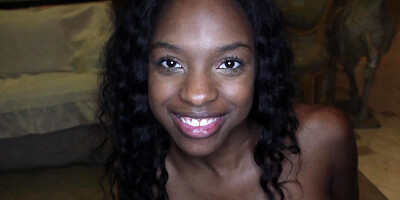 A black chick is kissing a large white dick close up to us