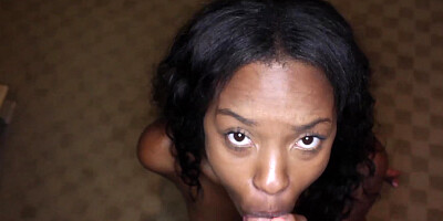A black chick is kissing a large white dick close up to us