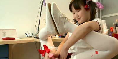 Asian beauty named Vanessa guides a toy in her hole