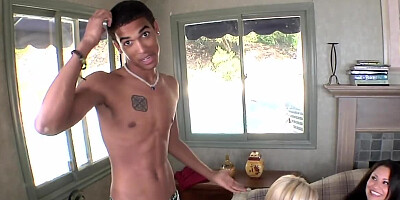 Two guys fool around on sofa with three attractive girls