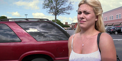 A lust filled blonde is getting undressed in the back seat of a car