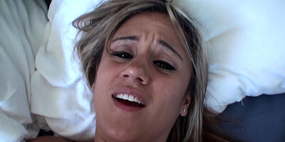 A blonde with a pretty face is getting a hot load of cum in her mouth