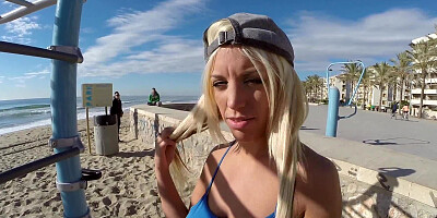 A blonde is on the beach, having sex in public with a horny dude