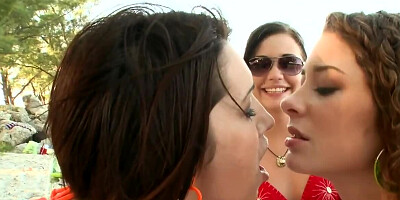 Three chicks and one dude are enjoying sex on the beach