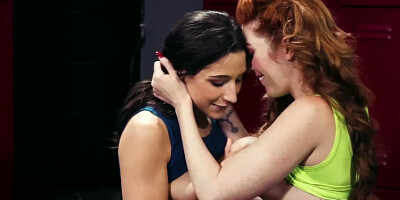 Redhead and brunette are exchanging some hot lesbian kisses