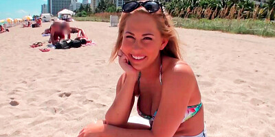 Smiling blonde has sex after a day at the beach