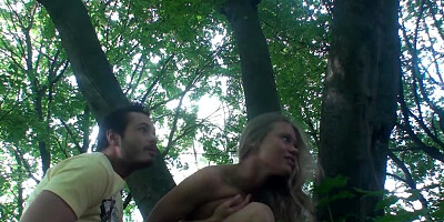 A horny amateur couple is having sex in nature and filming the whole thing