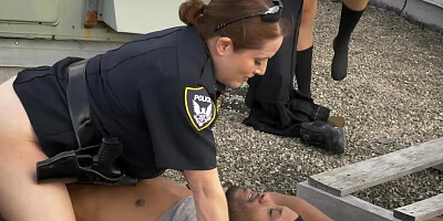 Two cop ladies and one black man are having 3some on the roof