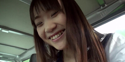 Asian shows tits off in the backseat and sucks driver's cock
