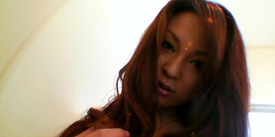Hot busty Asian babe masturbates in the bathroom