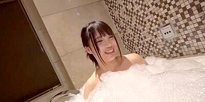 She goes to the bed and sits on top of her in cowgirl position while shaking her hips.