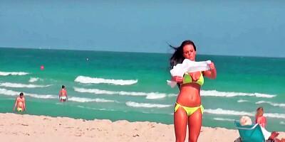 Sexy curves are seen on the beach in this scene