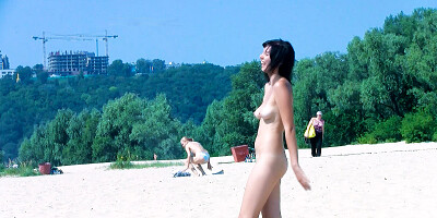 Hot nudist teen filmed by voyeur as she sits naked outside